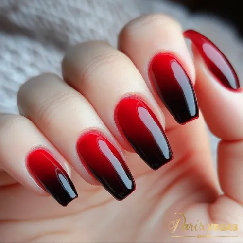 Unhas ombré vermelho e preto feitas por manicure perto de mim em Moema, São Paulo.