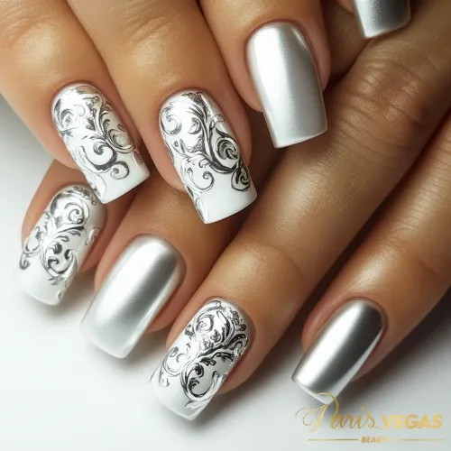 Unhas prata com arabescos elegantes, design refinado e criativo para um estilo único e sofisticado.