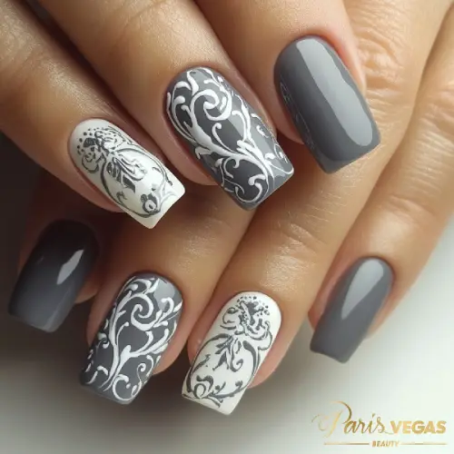 Unhas cinza decoradas com arabescos marcantes feitas no salão Paris Vegas Beauty em Moema.