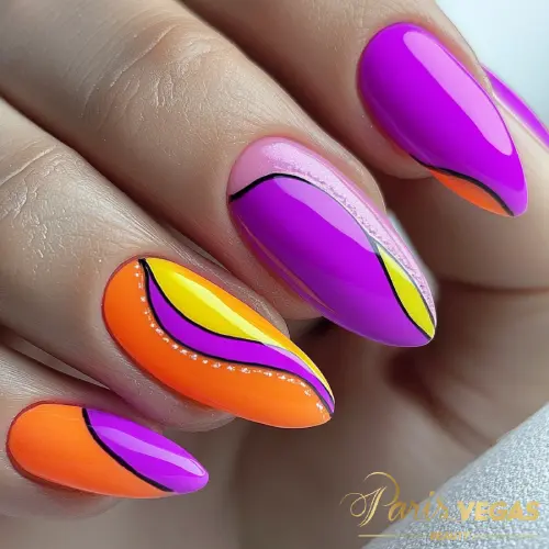 Unhas coloridas com mix de cores amarelo, laranja e roxo, feitas em Moema, São Paulo.